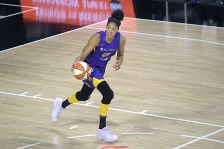 Candace Parker in a blue kit poses for a picture.